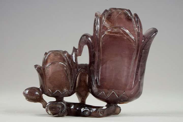 Amethyst group forming double vase depicting two magnolia flowers and branches